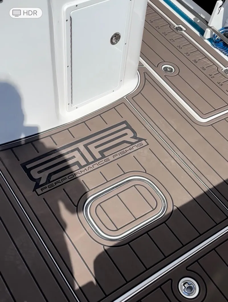 Slide: The Image of 2020 Tidewater 320 CC Adventure boat deck with custom performance design flooring. - 7