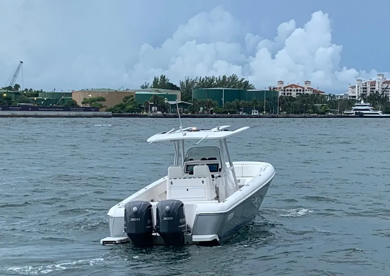 Slide: The Image of 2012 Intrepid 327 Center Console boat with twin engines on the water. - 7