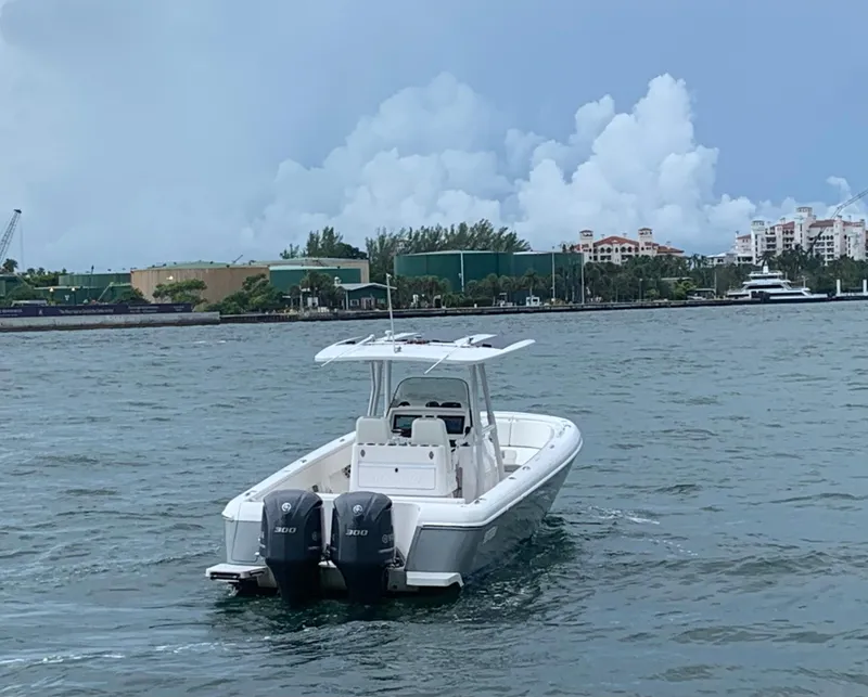 Slide: The Image of 2012 Intrepid 327 Center Console boat on water with twin 300 HP engines. - 8