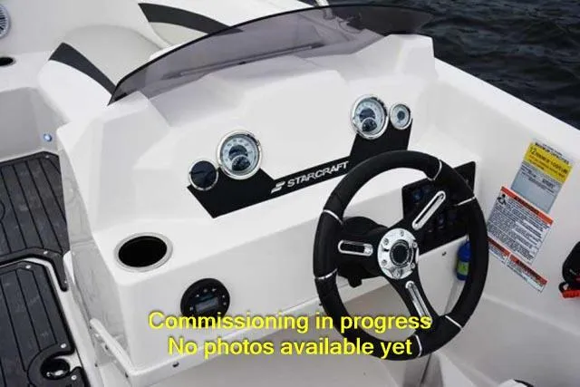 Slide: The Image of 2024 Starcraft SVX 211 OB boat dashboard with steering wheel and gauges. - 5