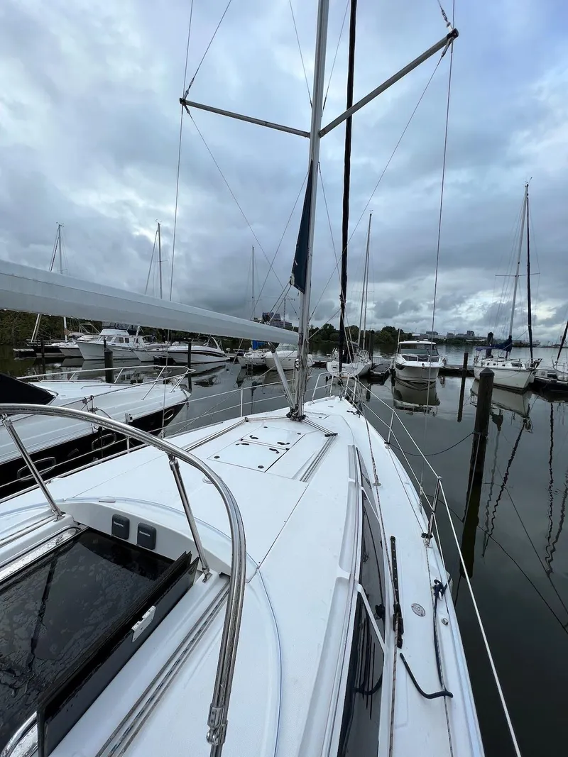 Slide: The Image of 2014 Marlow-Hunter e33 sailboat docked in a marina. - 3