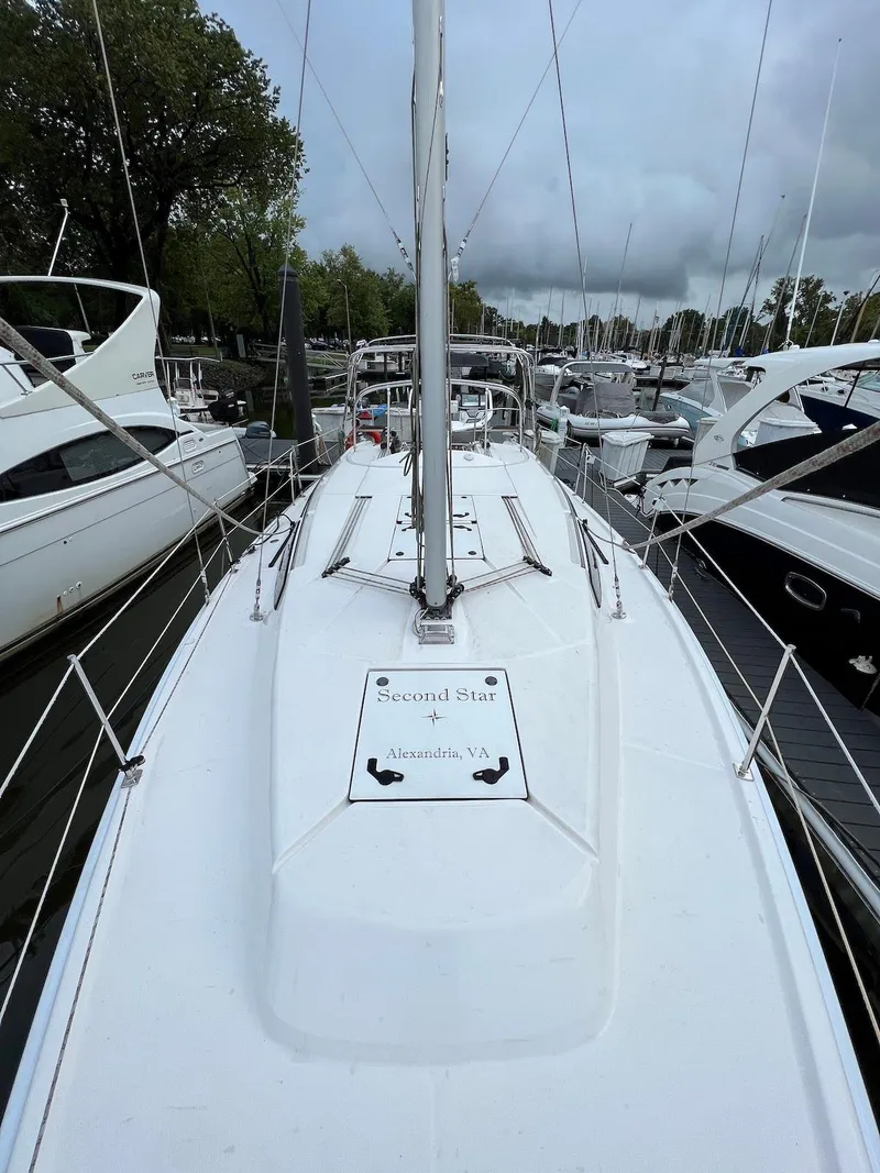 Slide: The Image of 2014 Marlow-Hunter e33 sailboat docked at a marina. - 4
