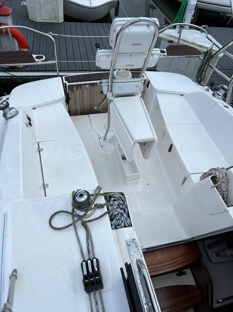 Slide: The Image of 2014 Marlow-Hunter e33 sailboat cockpit with steering wheel and seating area. - 7