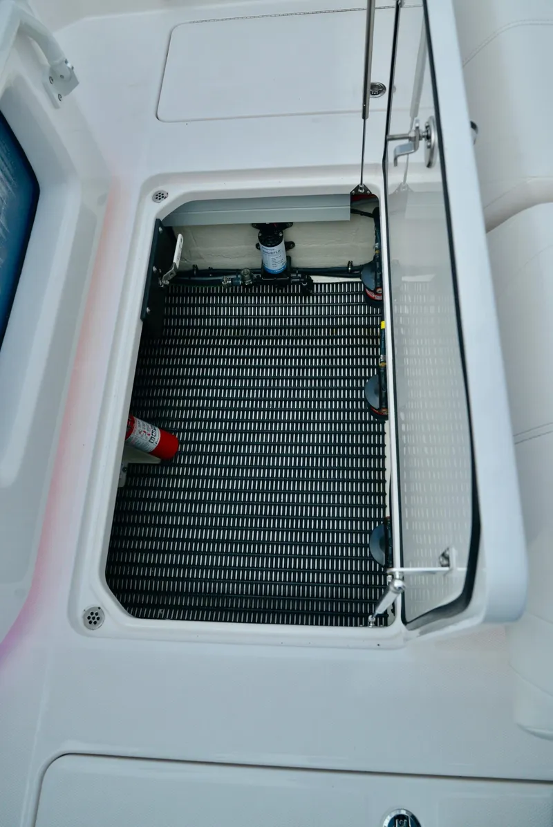 Slide: The Image of Open storage compartment on 2024 Fountain 32 NX boat. - 19