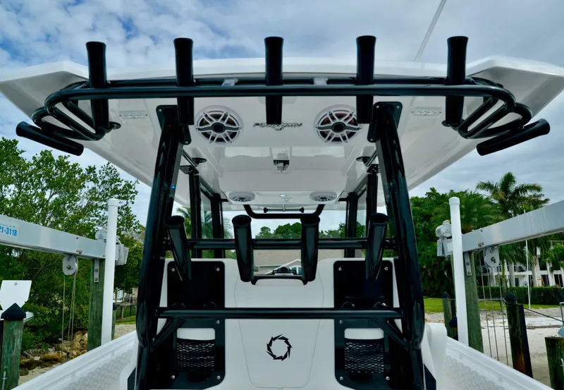 Slide: The Image of 2024 Fountain 32 NX boat with rod holders and speakers on the deck. - 22