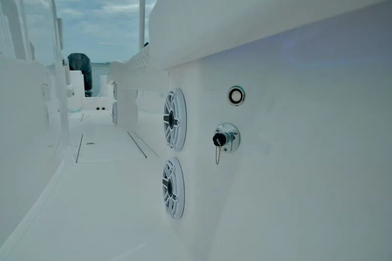 Slide: The Image of 2024 Fountain 32 NX boat deck with speakers and control panel. - 27
