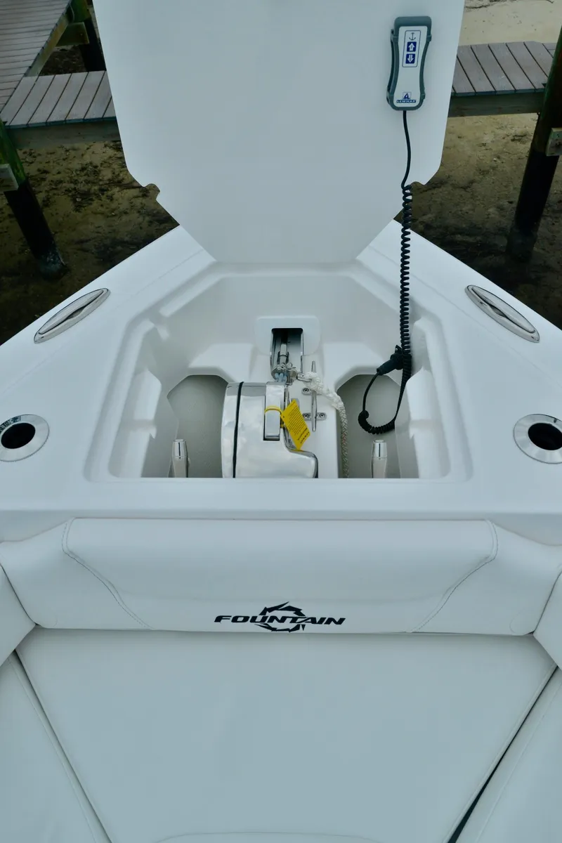 Slide: The Image of 2024 Fountain 32 NX boat anchor compartment with control panel. - 28