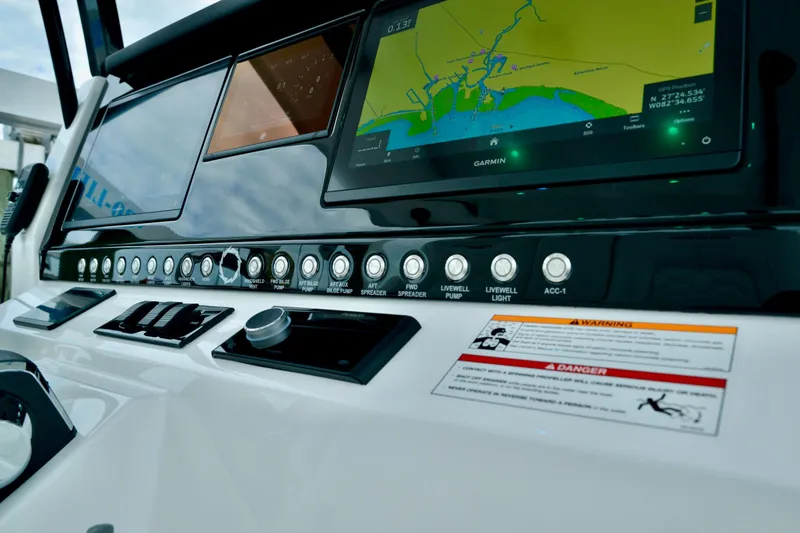 Slide: The Image of 2024 Fountain 32 NX boat dashboard with navigation screen and control buttons. - 29