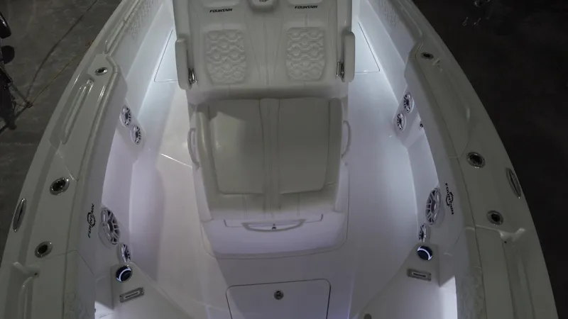 Slide: The Image of 2024 Fountain 32 NX boat interior with illuminated seating and modern design. - 38