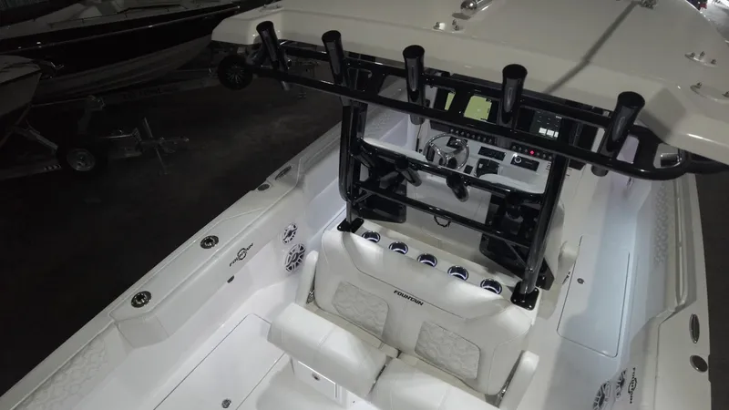 Slide: The Image of 2024 Fountain 32 NX boat interior with advanced navigation system and seating. - 40