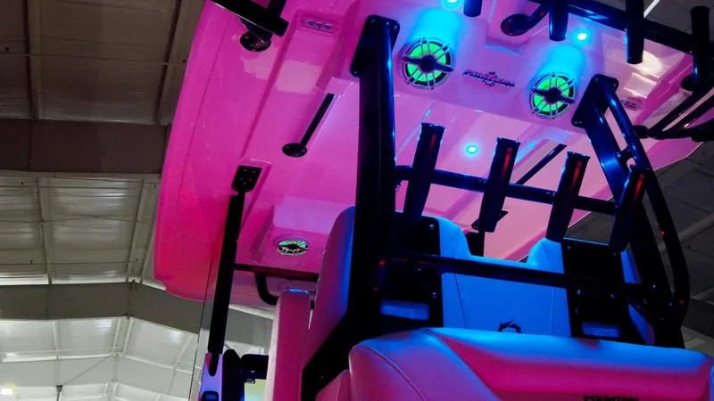 Slide: The Image of 2024 Fountain 32 NX boat interior with vibrant LED lighting. - 43