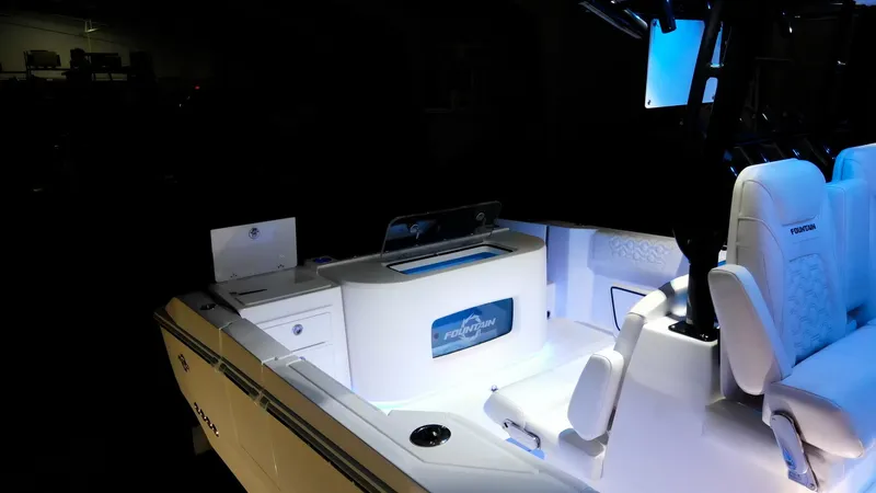 Slide: The Image of 2024 Fountain 32 NX boat interior with illuminated seating and storage compartments. - 46