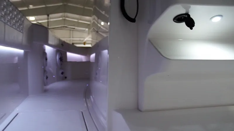 Slide: The Image of Interior view of 2024 Fountain 32 NX boat with ambient lighting. - 55