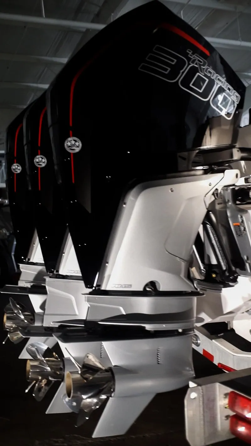 Slide: The Image of 2024 Fountain 32 NX boat with triple outboard engines. - 58