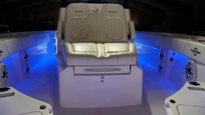 Slide: The Image of 2024 Fountain 32 NX boat interior with illuminated seating and modern design. - 59