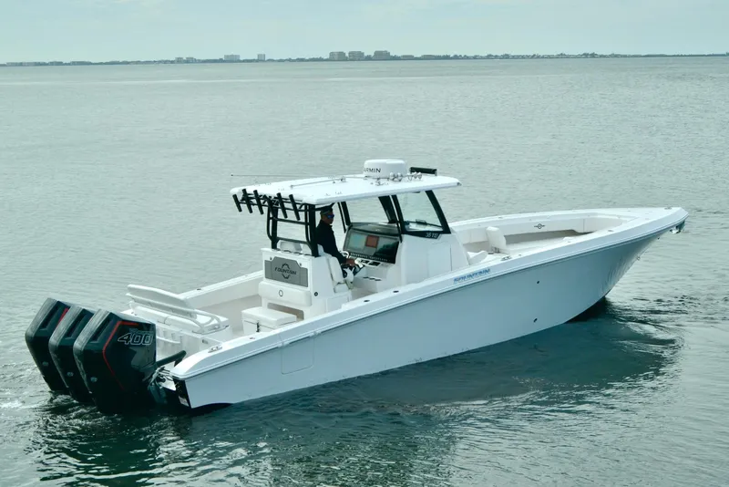 Slide: The Image of 2024 Fountain Bluewater 38 Tournament Edition boat on calm water. - 1