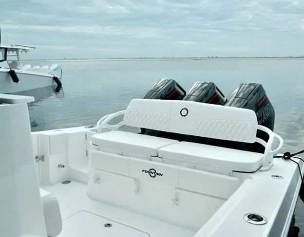 Slide: The Image of 2024 Fountain Bluewater 38 Tournament Edition boat with triple outboard engines. - 10