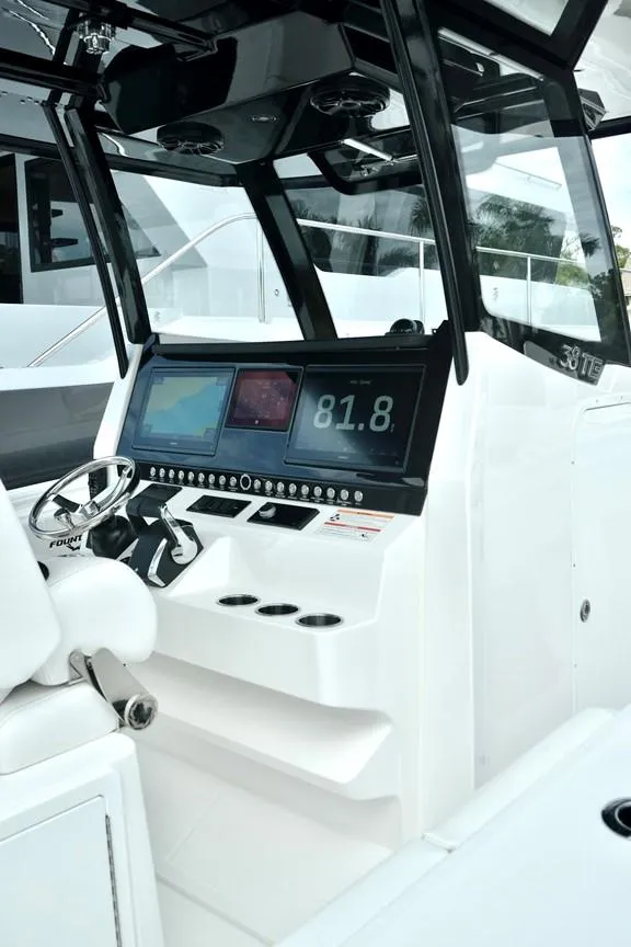 Slide: The Image of 2024 Fountain Bluewater 38 Tournament Edition boat console with advanced navigation displays. - 12