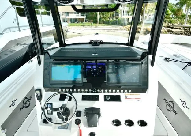 Slide: The Image of 2024 Fountain Bluewater 38 Tournament Edition boat dashboard with advanced navigation systems. - 15