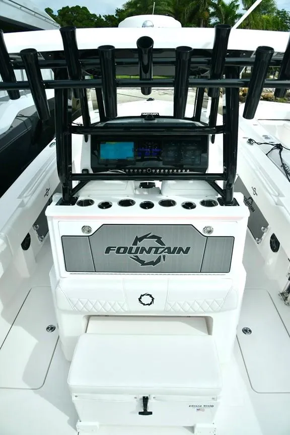 Slide: The Image of 2024 Fountain Bluewater 38 Tournament Edition boat console and seating area. - 16