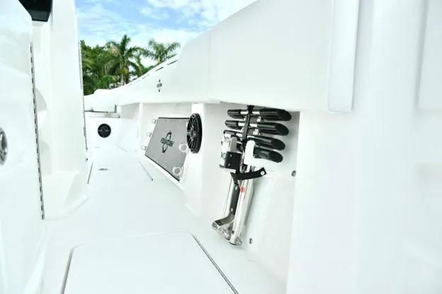 Slide: The Image of 2024 Fountain Bluewater 38 Tournament Edition boat interior with rod holders and storage compartments. - 19