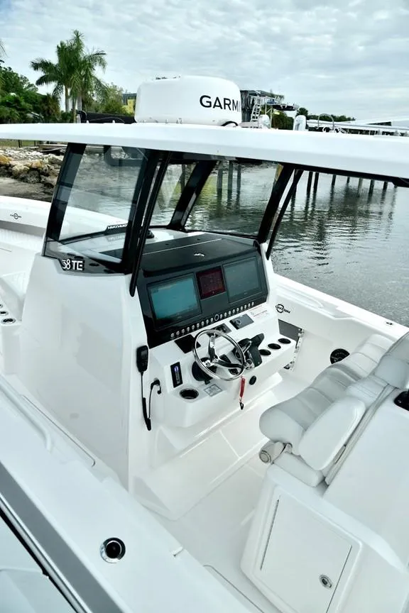 Slide: The Image of 2024 Fountain Bluewater 38 Tournament Edition boat console and seating. - 9