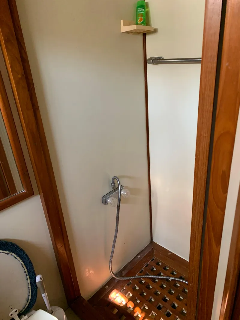 Slide: The Image of 1987 Kha Shing Vista 40 yacht bathroom with shower and wooden floor. - 19