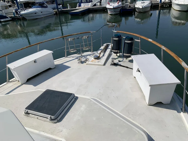 Slide: The Image of 1987 Kha Shing Vista 40 yacht deck with storage benches at marina. - 20