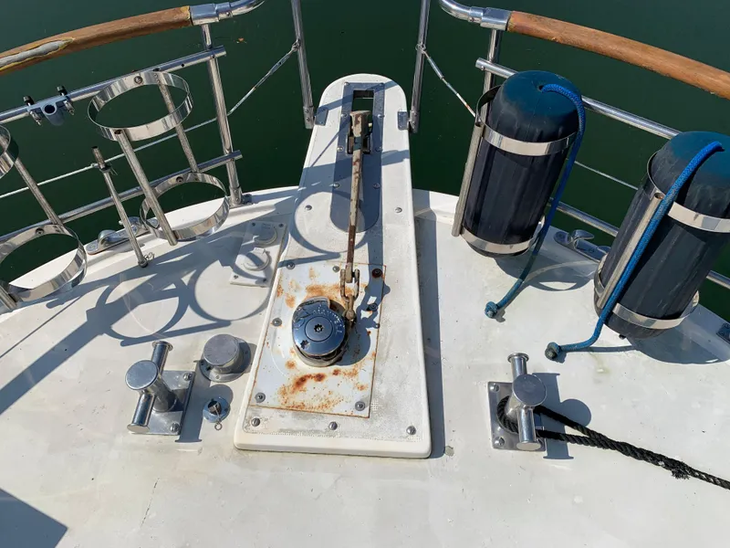 Slide: The Image of Deck of 1987 Kha Shing Vista 40 yacht with anchor winch and fenders. - 21