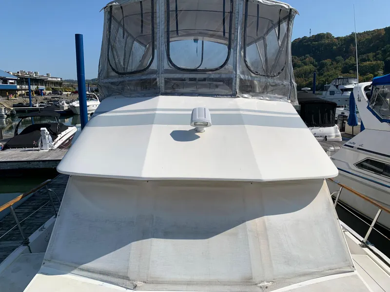 Slide: The Image of 1987 Kha Shing Vista 40 yacht docked at a marina. - 22