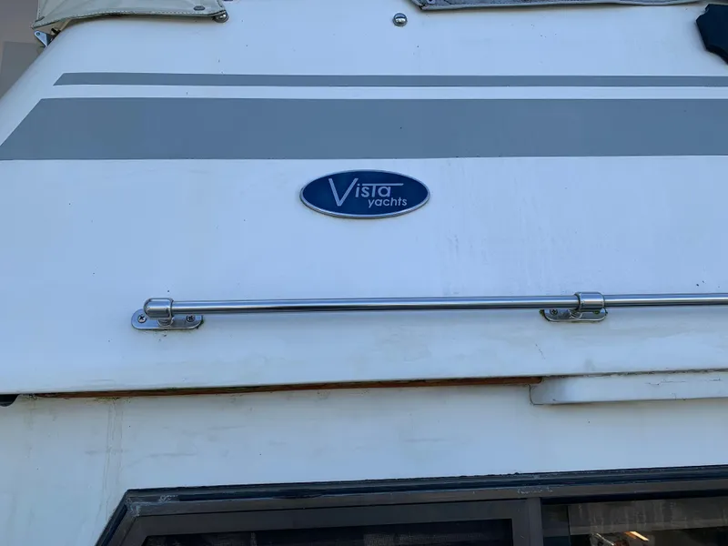 Slide: The Image of 1987 Kha Shing Vista 40 yacht exterior with Vista Yachts logo. - 23