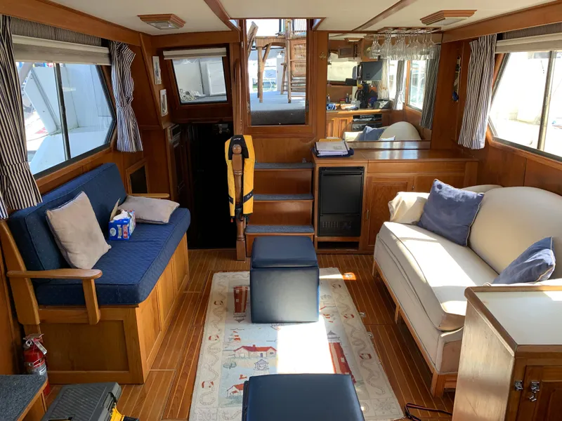 Slide: The Image of Interior of 1987 Kha Shing Vista 40 yacht with cozy seating and wooden decor. - 7