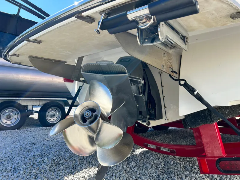 Slide: The Image of Close-up of 2009 Cobalt 222 boat propeller and stern drive on trailer. - 12