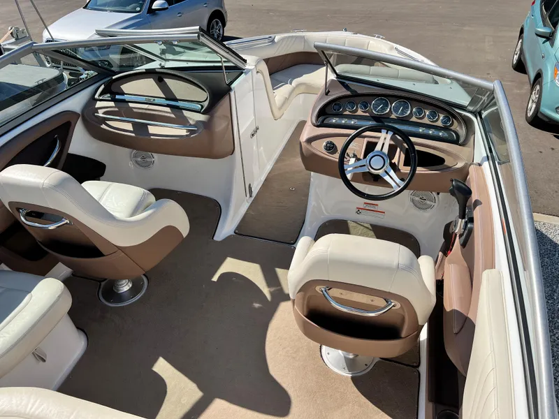Slide: The Image of Interior of a 2009 Cobalt 222 boat with beige and brown seating. - 14