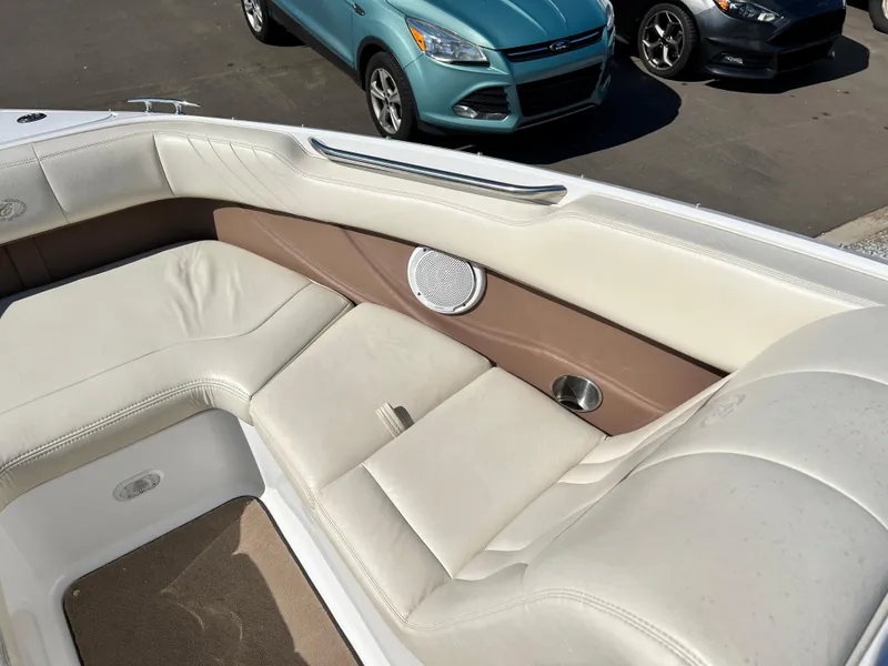 Slide: The Image of Interior seating of a 2009 Cobalt 222 boat with beige and brown upholstery. - 20