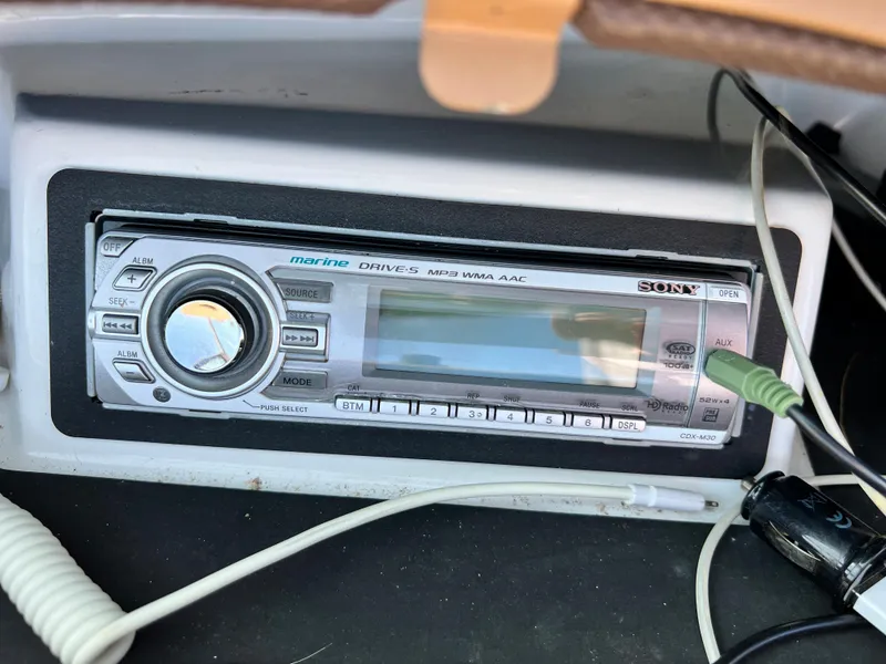 Slide: The Image of 2009 Cobalt 222 boat stereo system with various input cables. - 29
