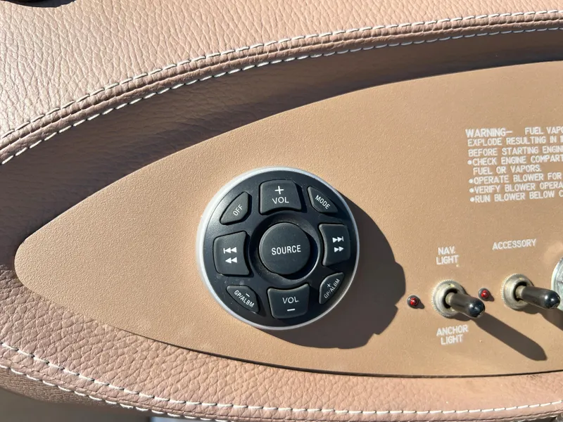 Slide: The Image of Control panel of a 2009 Cobalt 222 boat with audio and light switches. - 30