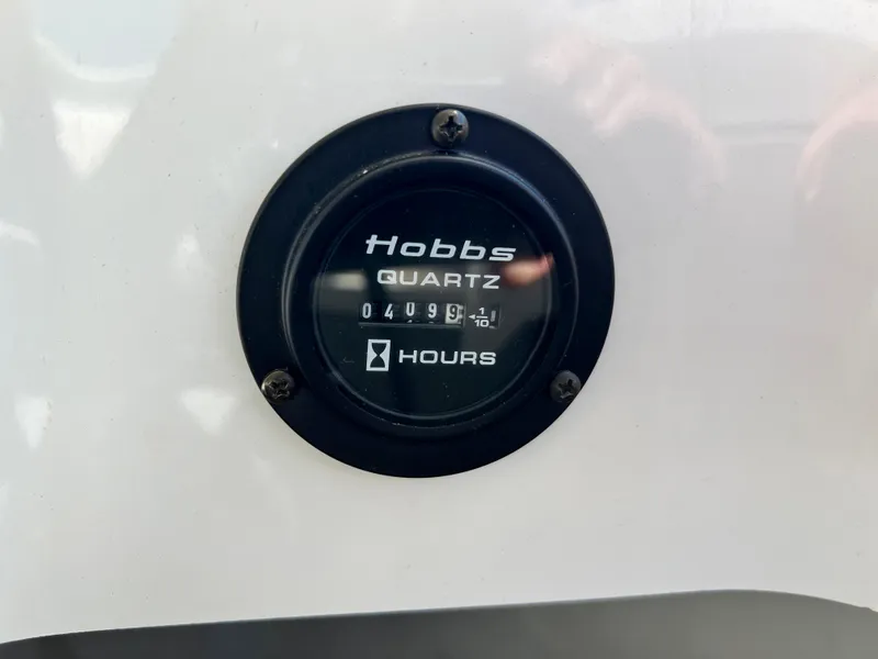 Slide: The Image of Hobbs quartz hour meter on a 2009 Cobalt 222 boat showing 499.1 hours. - 33
