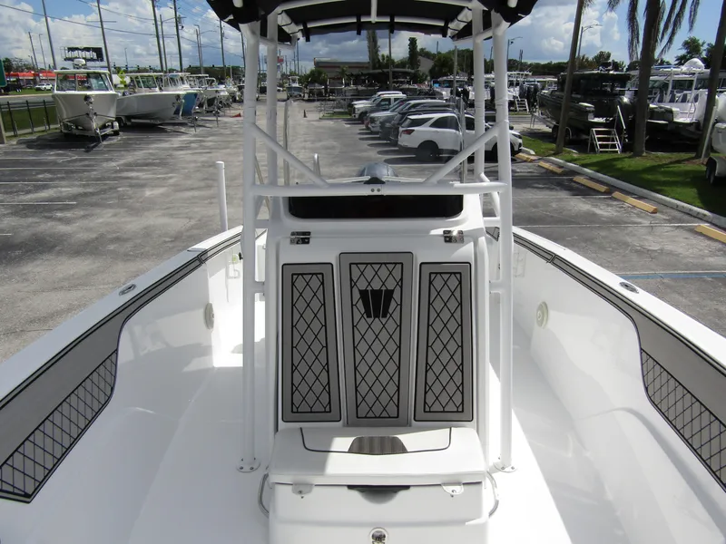 Slide: The Image of 2024 Wellcraft 202 Fisherman boat, white deck, marina background, sunny day. - 11