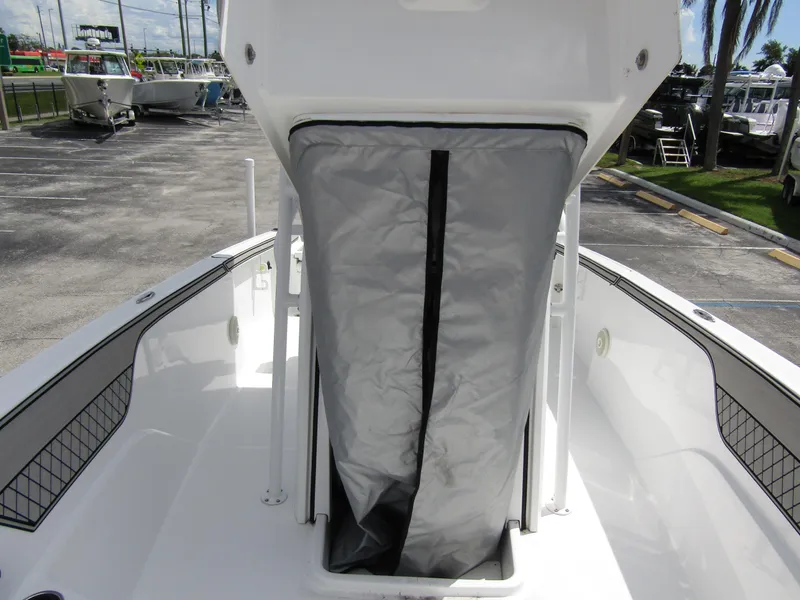 Slide: The Image of 2024 Wellcraft 202 Fisherman boat interior with storage compartment. - 12