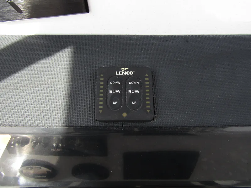 Slide: The Image of Lenco trim tab control on 2024 Wellcraft 202 Fisherman boat dashboard. - 19