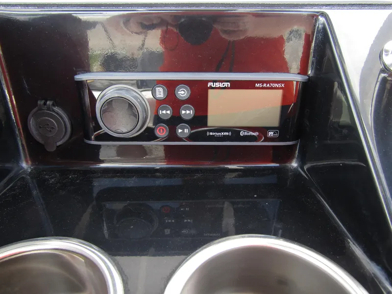 Slide: The Image of 2024 Wellcraft 202 Fisherman boat dashboard with Fusion MS-RA70NSX stereo system. - 21