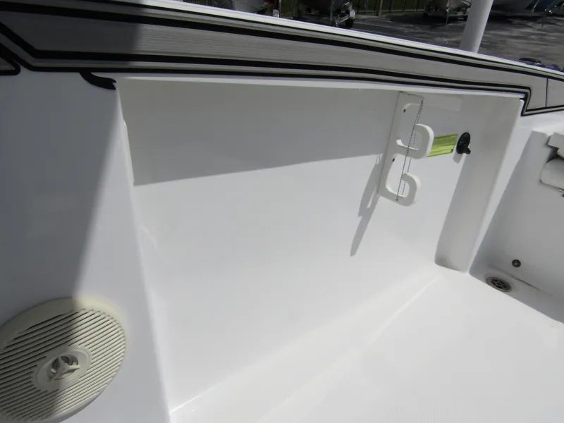 Slide: The Image of 2024 Wellcraft 202 Fisherman boat interior detail with speaker and rod holder. - 22