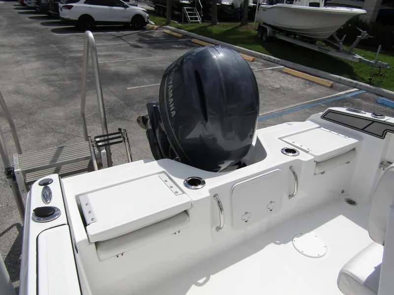 Slide: The Image of 2024 Wellcraft 202 Fisherman boat with Yamaha outboard motor in parking lot. - 23
