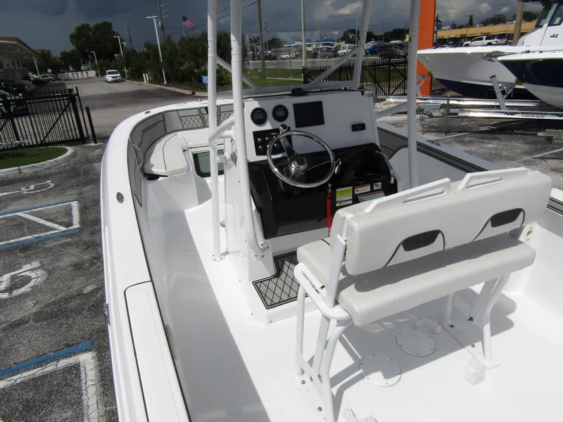 Slide: The Image of 2024 Wellcraft 202 Fisherman boat interior with steering console and seating. - 26