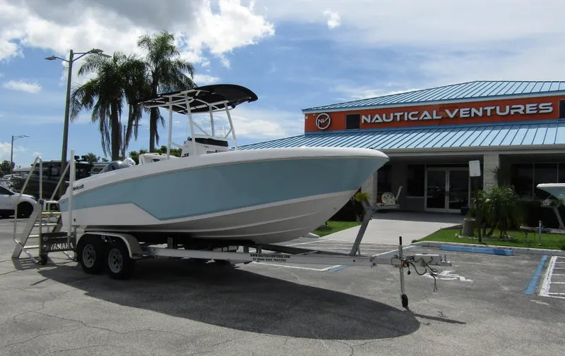 Slide: The Image of 2024 Wellcraft 202 Fisherman boat on trailer outside Nautical Ventures store. - 5