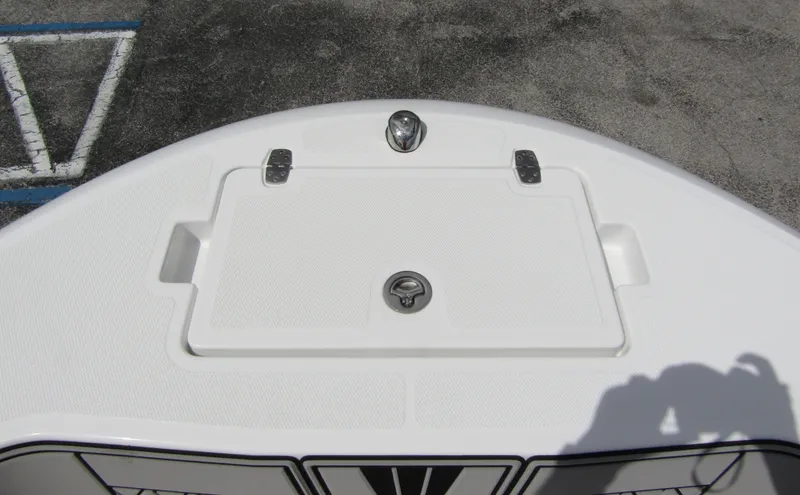 Slide: The Image of 2024 Wellcraft 202 Fisherman boat deck with storage compartment and latch. - 8