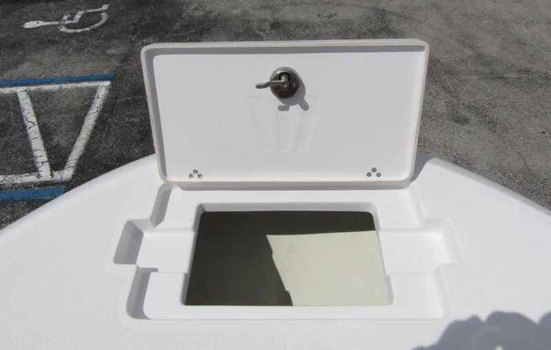 Slide: The Image of 2024 Wellcraft 202 Fisherman boat storage compartment with open lid. - 9