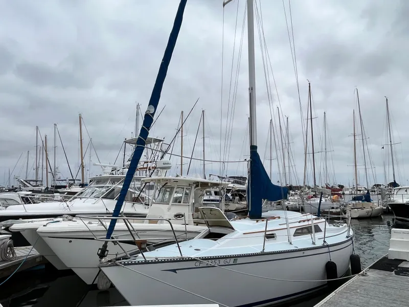 Slide: The Image of 1979 Ranger Yachts 30 sailboat docked in a marina with other boats. - 0