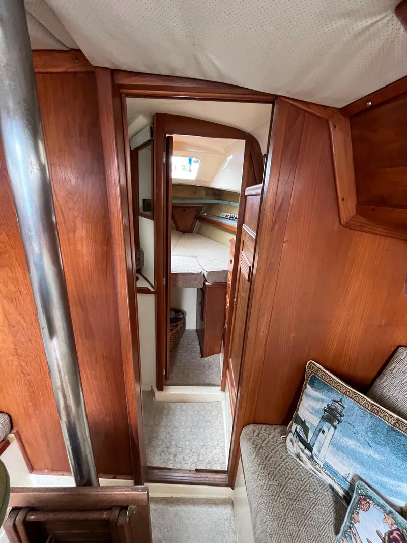 Slide: The Image of 1979 Ranger Yachts 30 interior with wood paneling and cozy cabin space. - 28